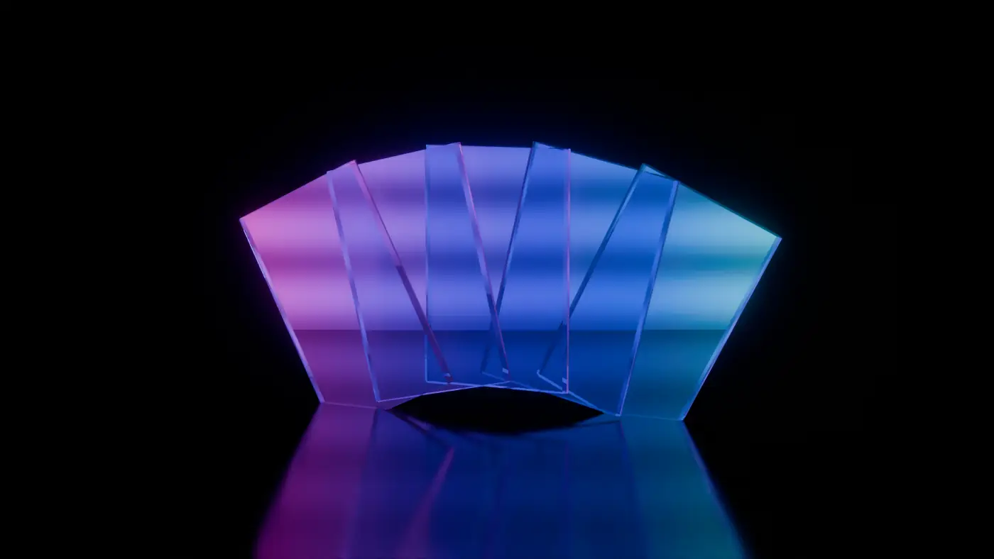 Five blank glass cards fanned out, tinted from magenta to cyan